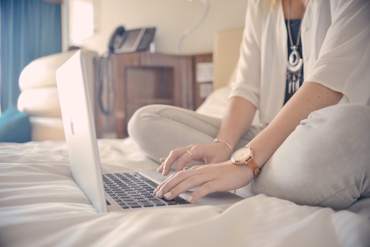 jobs in Australia for foreigners - woman working on laptop inside the bedroom